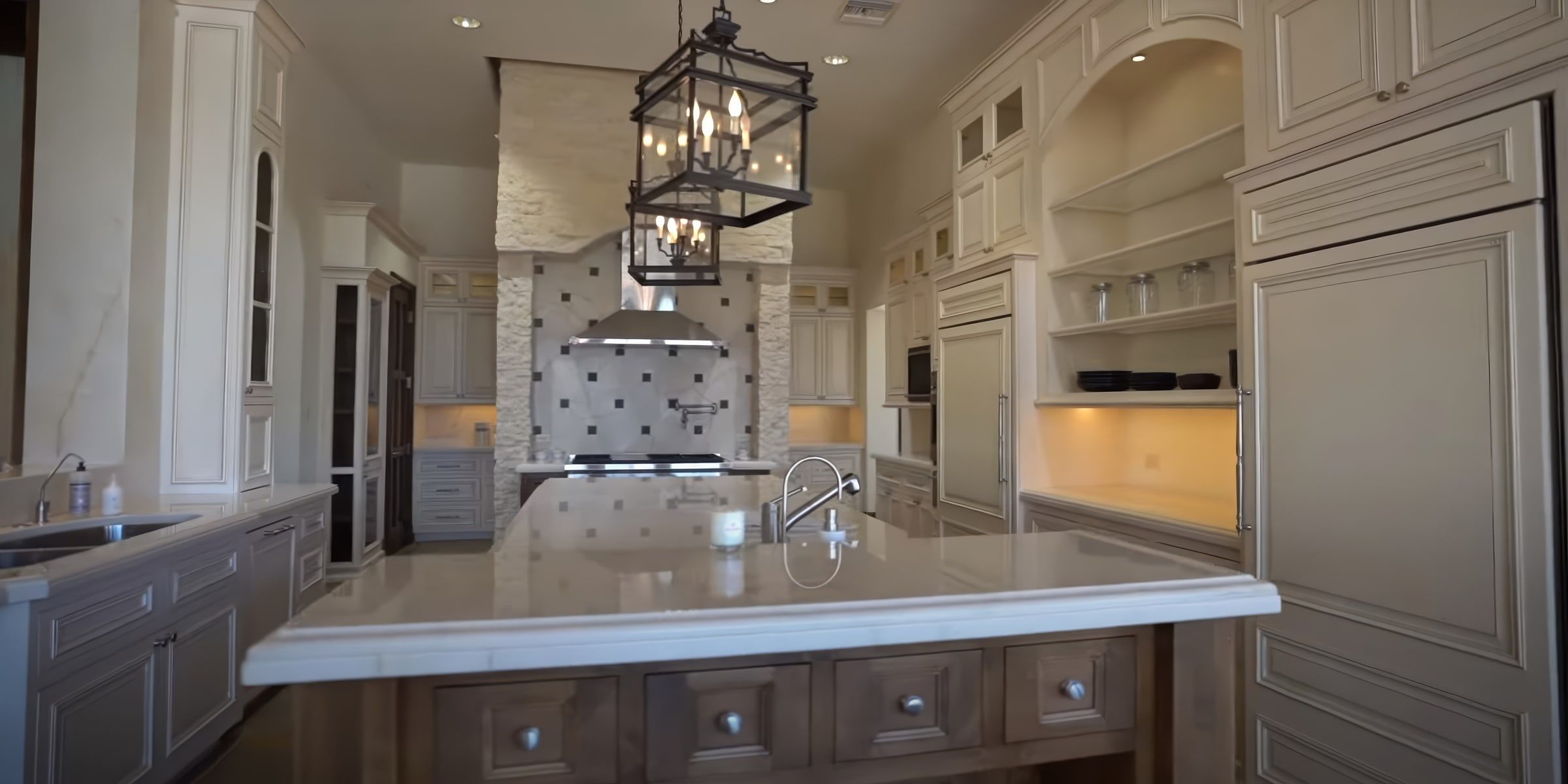 Finished kitchen with painted walls, ceiling, crown molding and cream cabinets