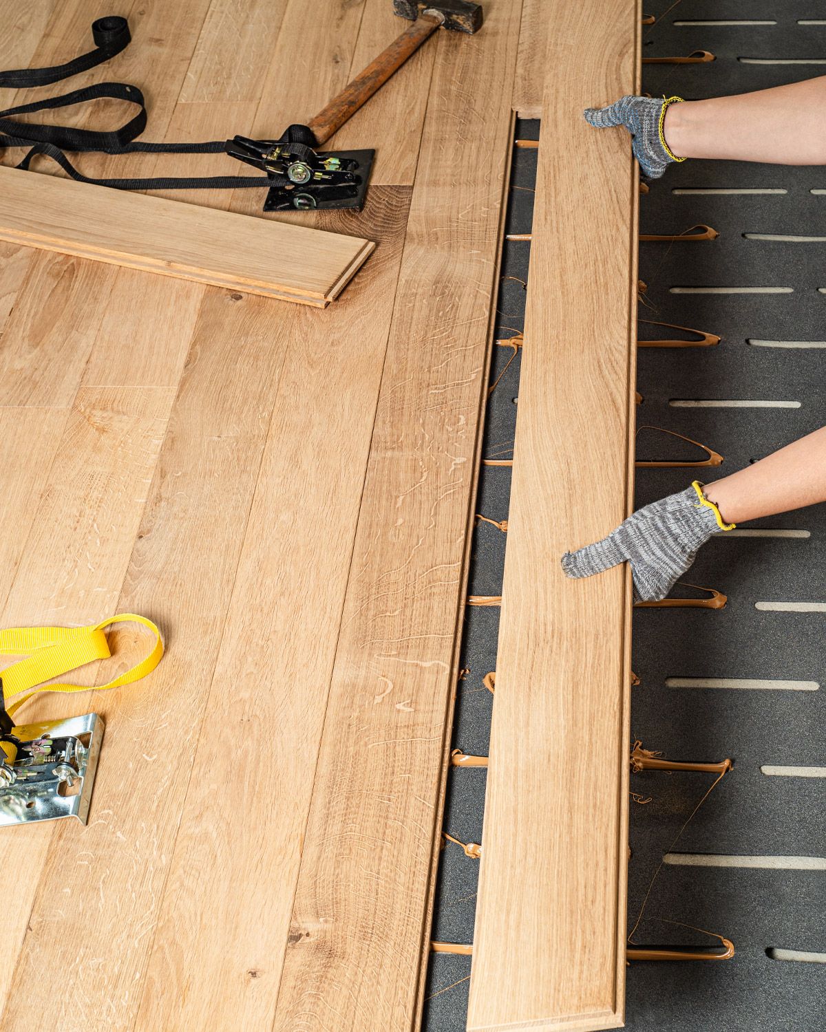 Hardwood floor boards being installed