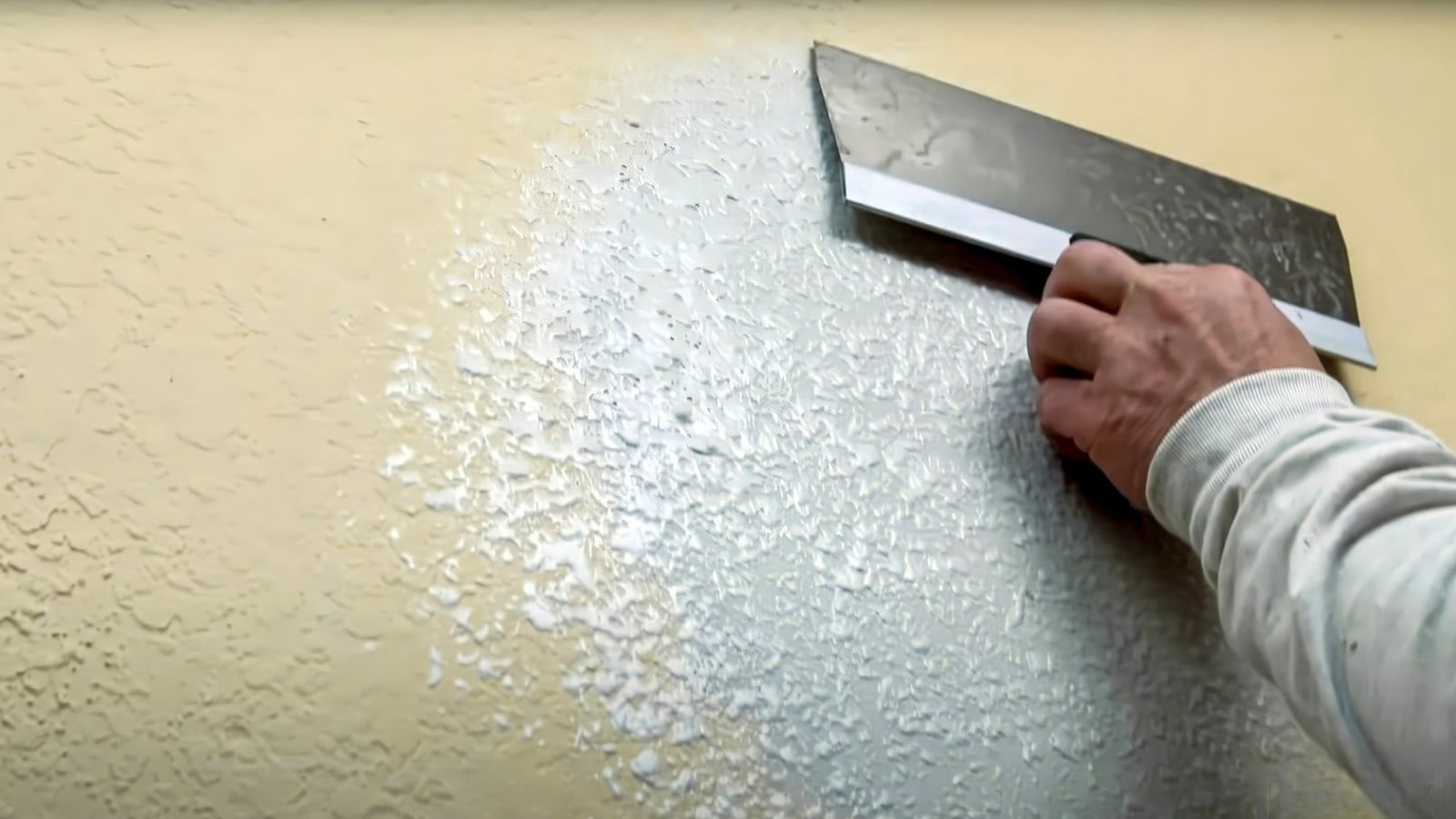 Matching wall texture with a knife before painting