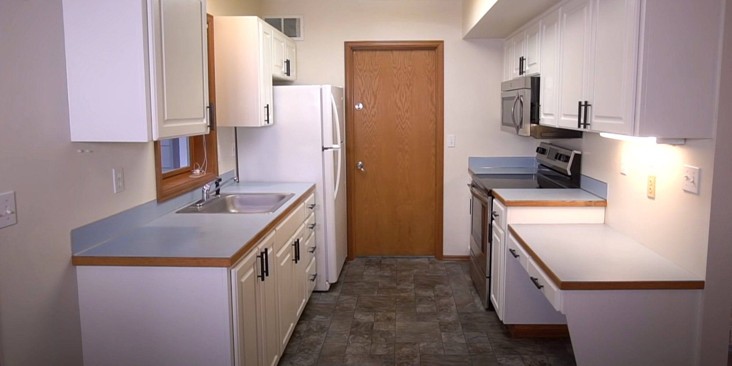 The same kitchen with cabinets painted white