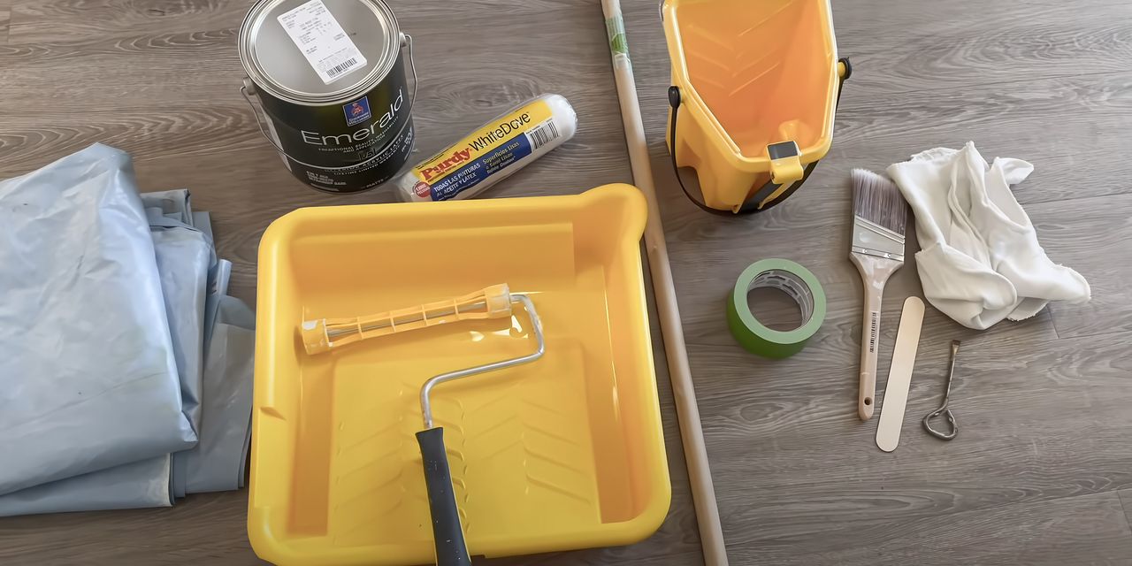 Painting supplies: roller, tray, tape and brushes
