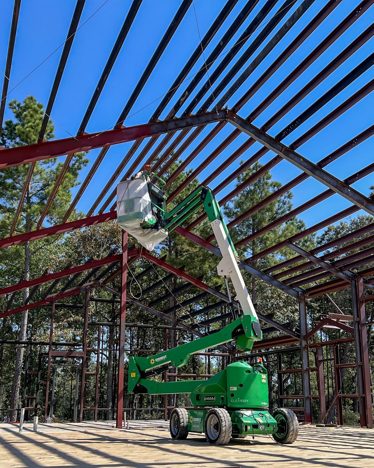 Painting a steel framework from a lift