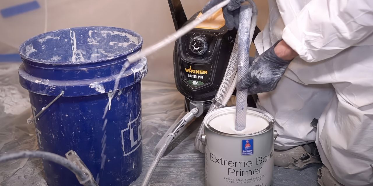 Primer being prepared for a sprayer