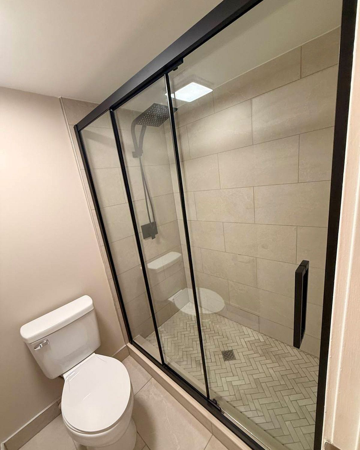 Bathroom with a new walk-in shower and glass doors