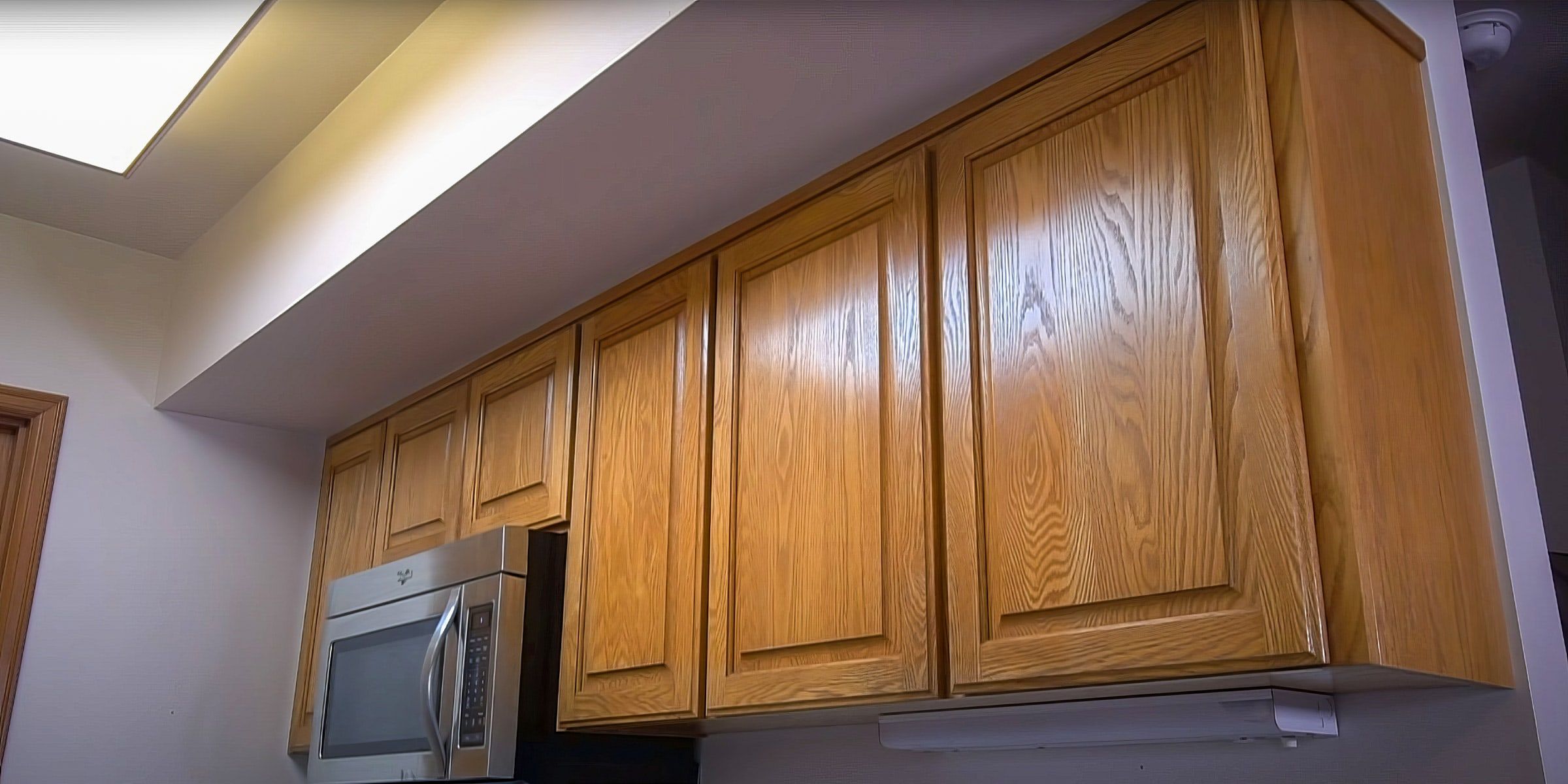 Oak upper cabinets before painting
